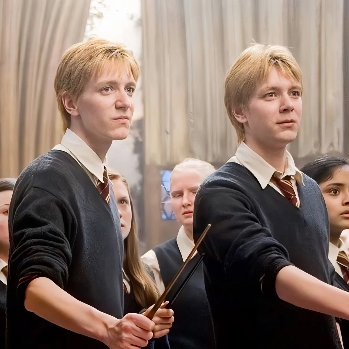 Fred and George Weasley with wands drawn