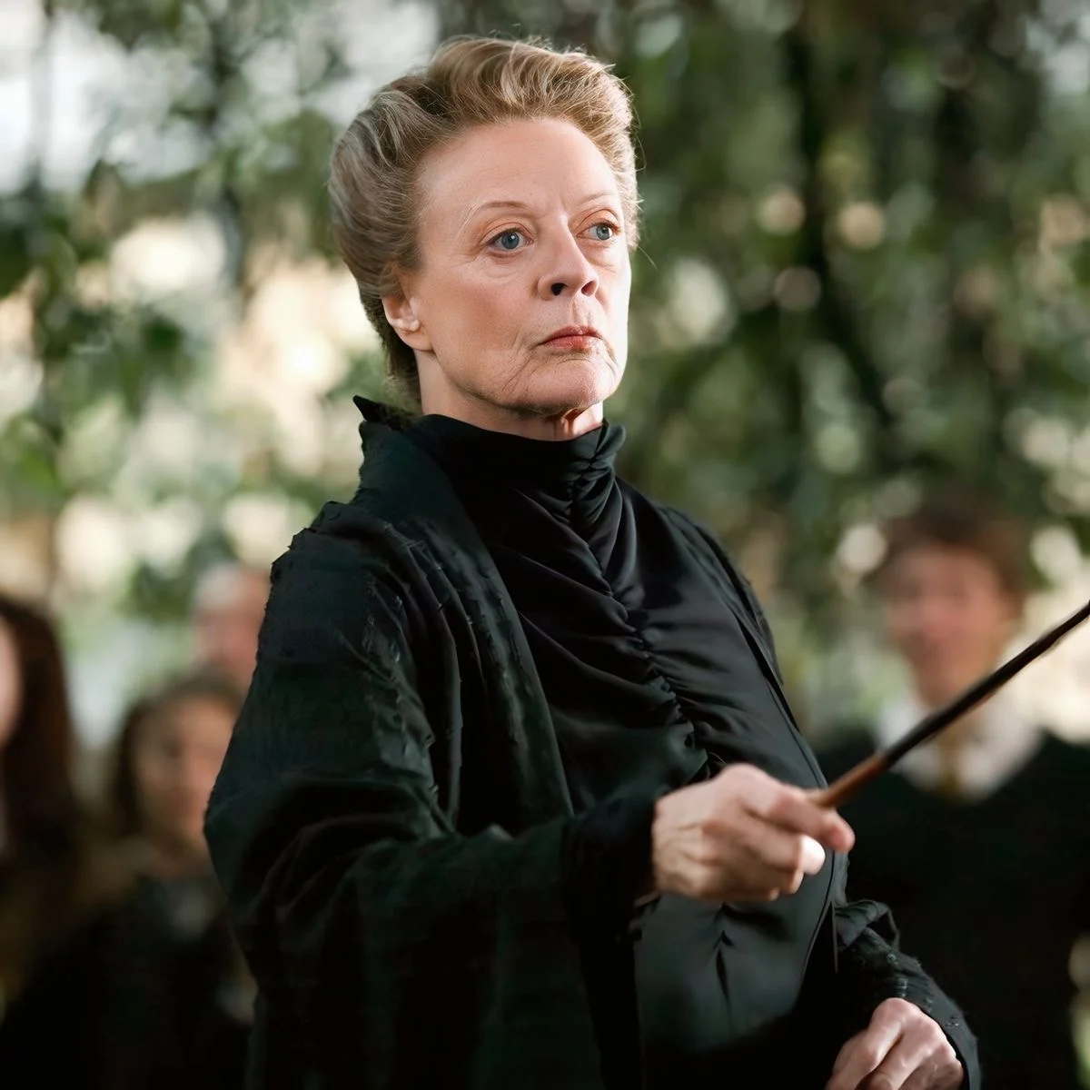 Minerva McGonagall with her wand raised