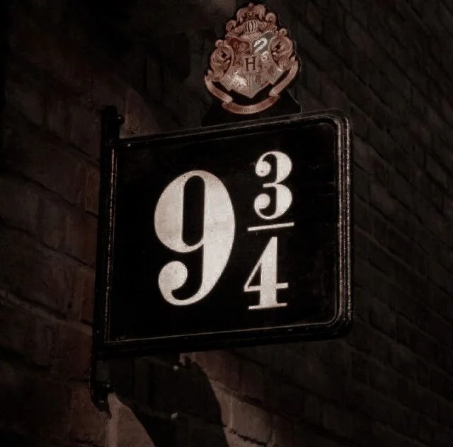 The platform nine and three quarters sign on a brick wall