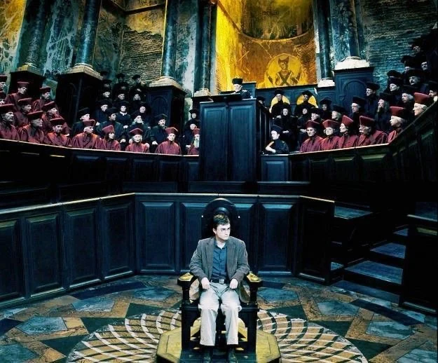 Harry alone in a chair before the full Wizengamot