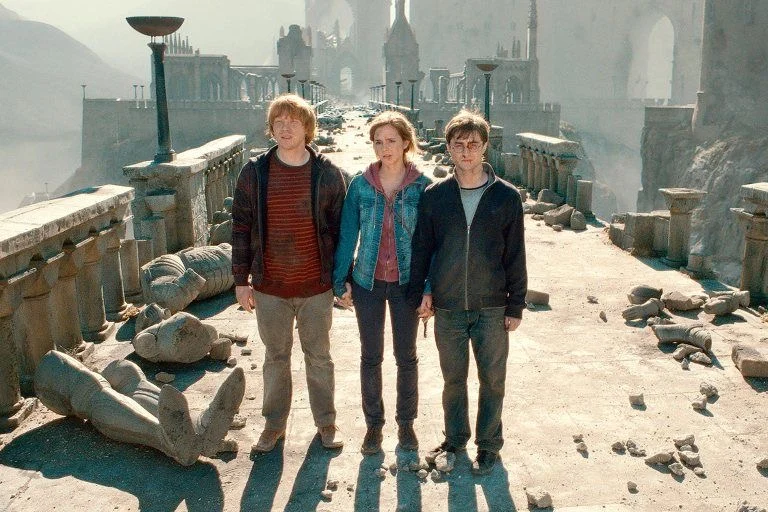 Ron, Hermione and Harry on a ruined bridge after the battle