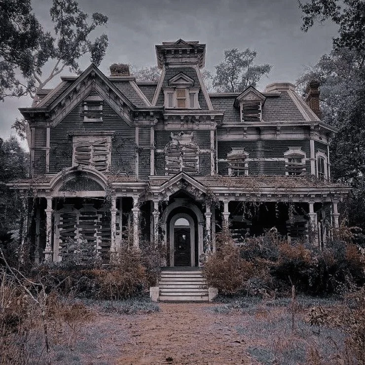 The boarded up Creel house under a grey sky