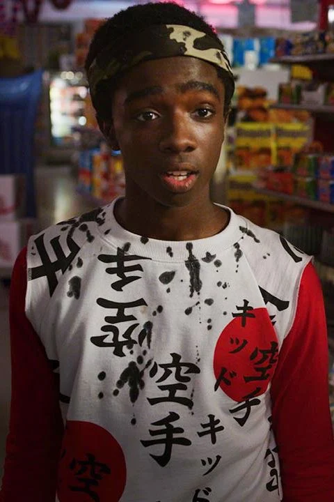 Lucas Sinclair in a camouflage headband