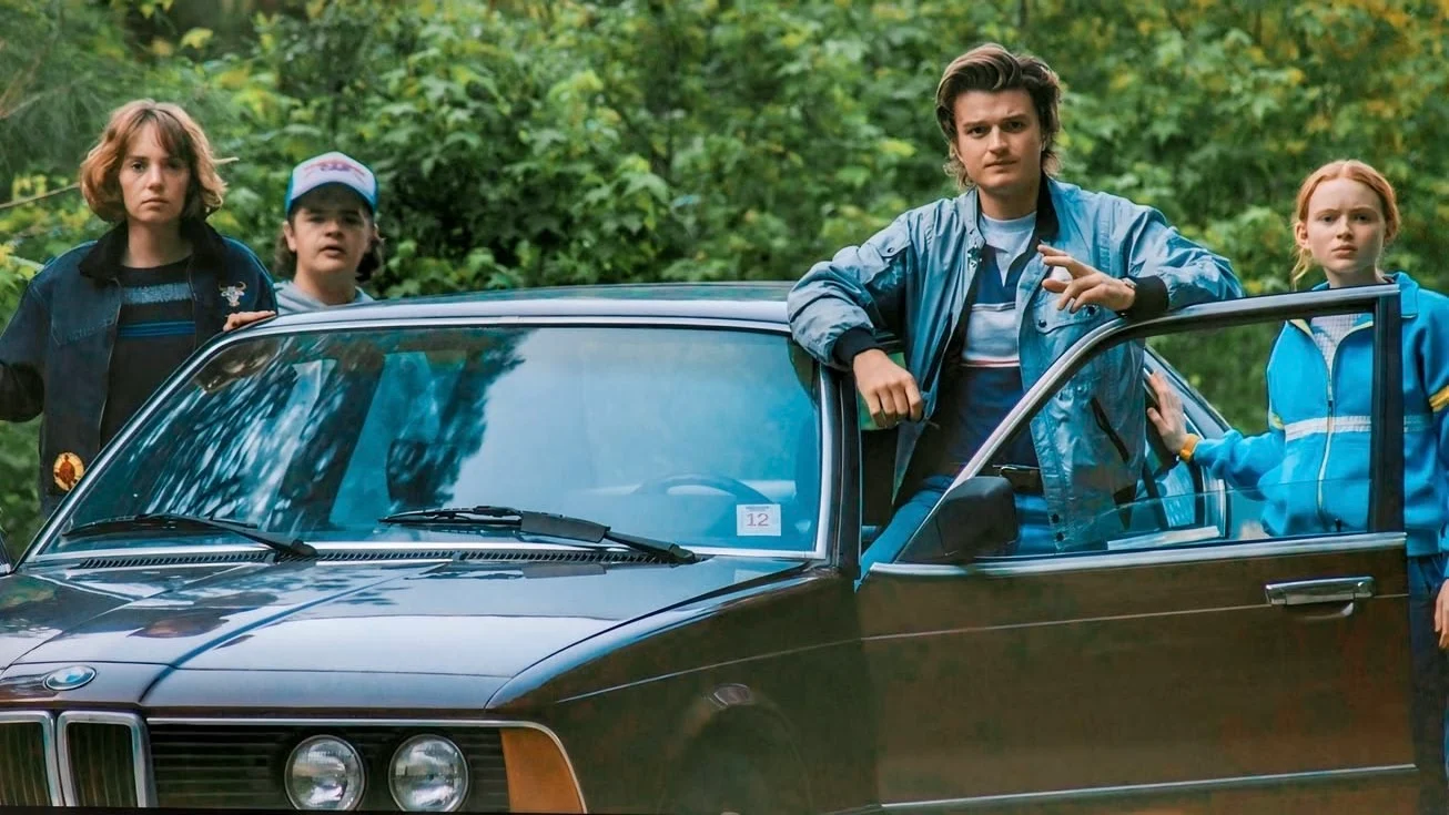 Steve at his car with Robin, Dustin and Max
