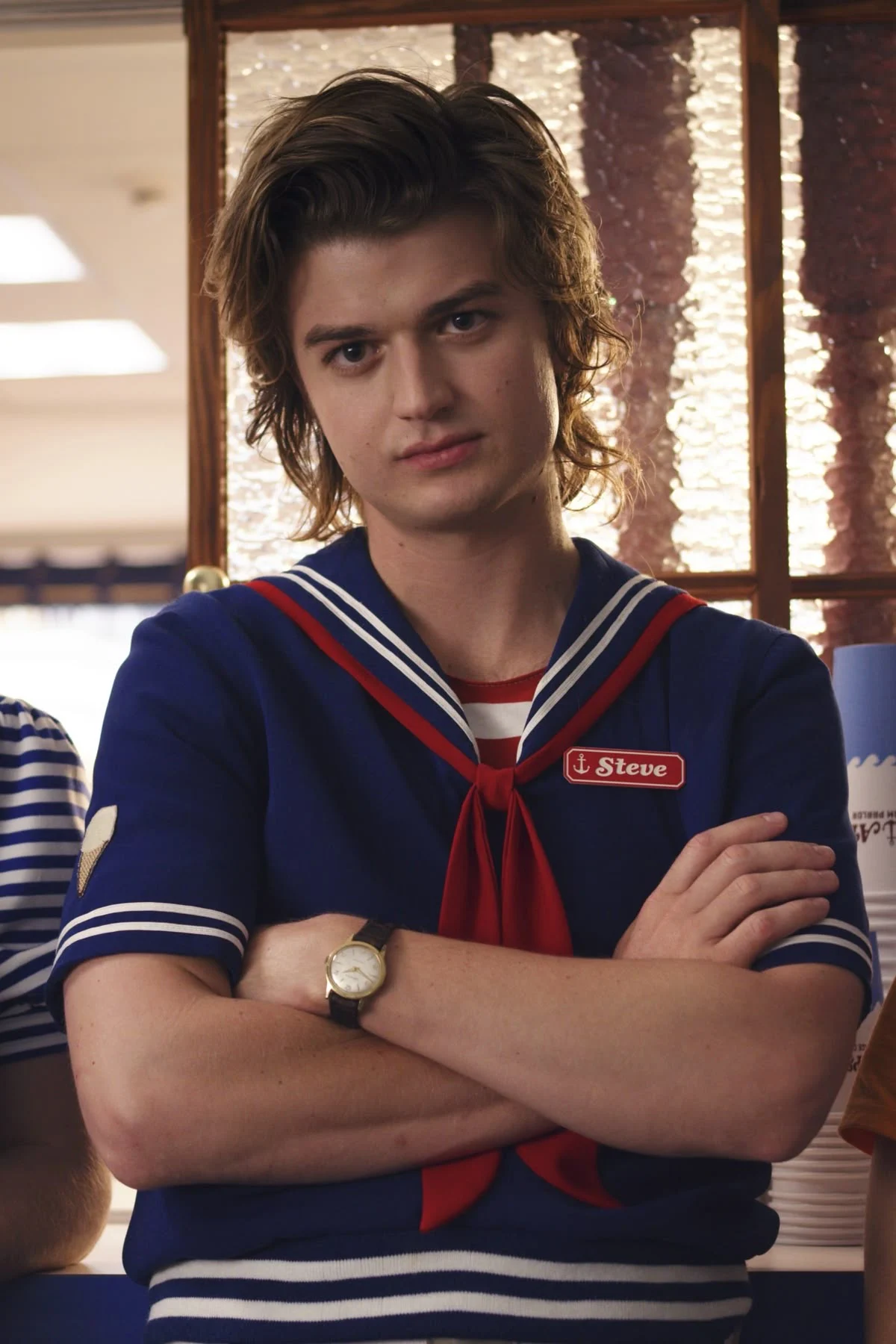 Steve Harrington in a Scoops Ahoy sailor uniform
